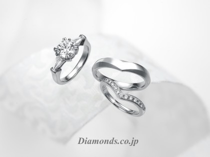 A beautiful 1 carat diamond engagement ring with wedding bands E Color